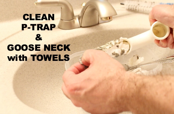 Clean p-trap and goose neck with towels