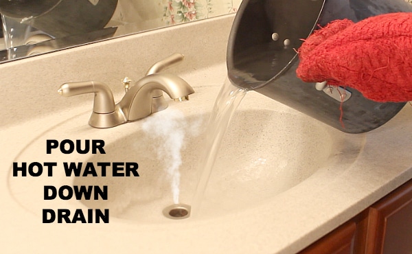Pour hot water down drain