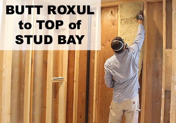 Butt roxul to top of stud bay