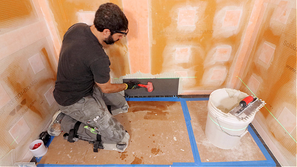 Tapping Wall Tile with Mallet