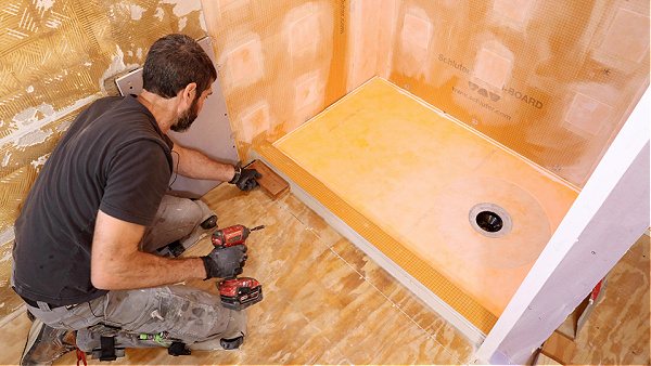 Using Lumber to Keep Shower Curb Stationary